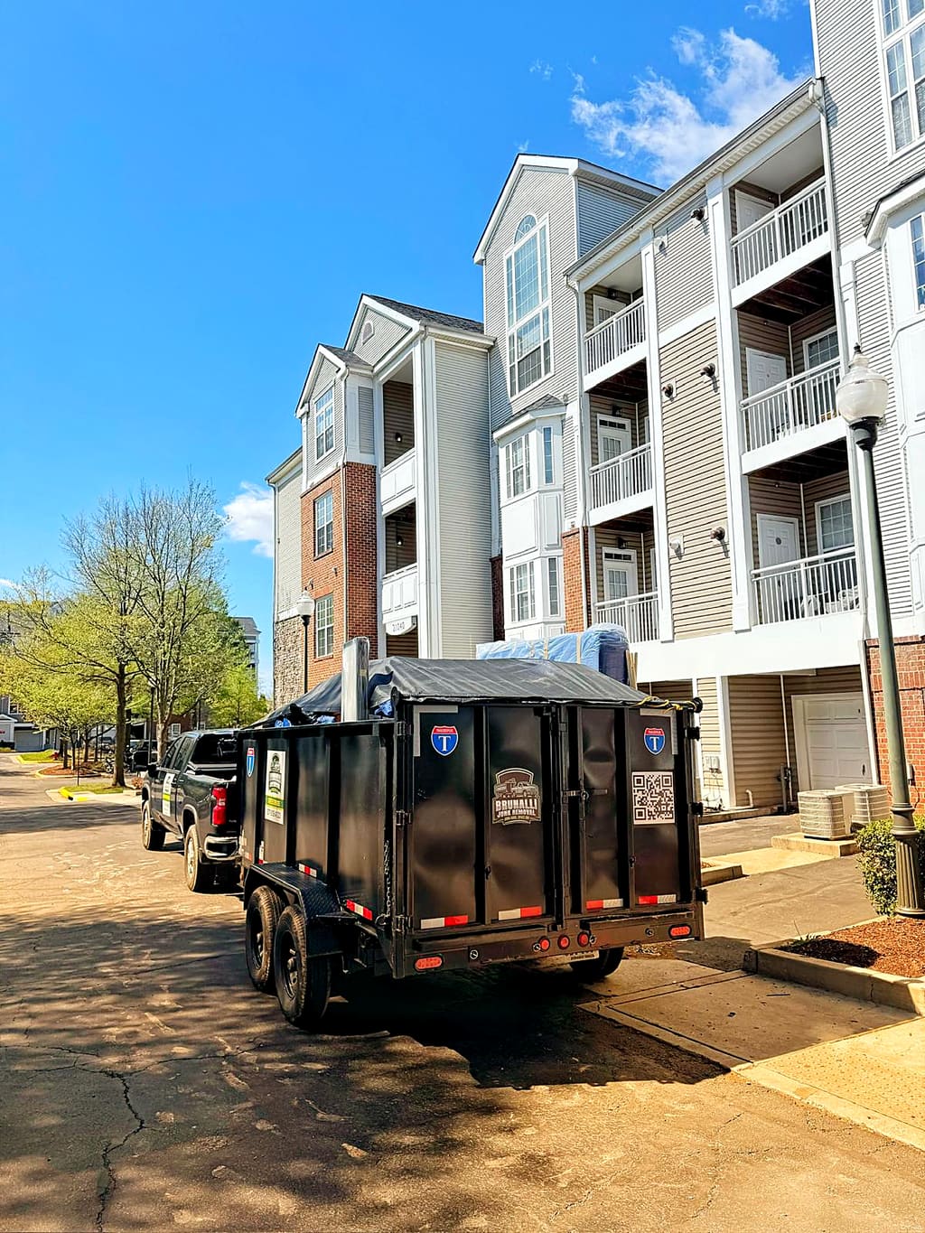 Dump trailer parked at an apartment complex
