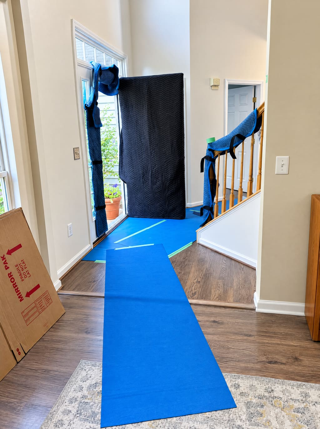 A foyer with floor runners laid from the front door