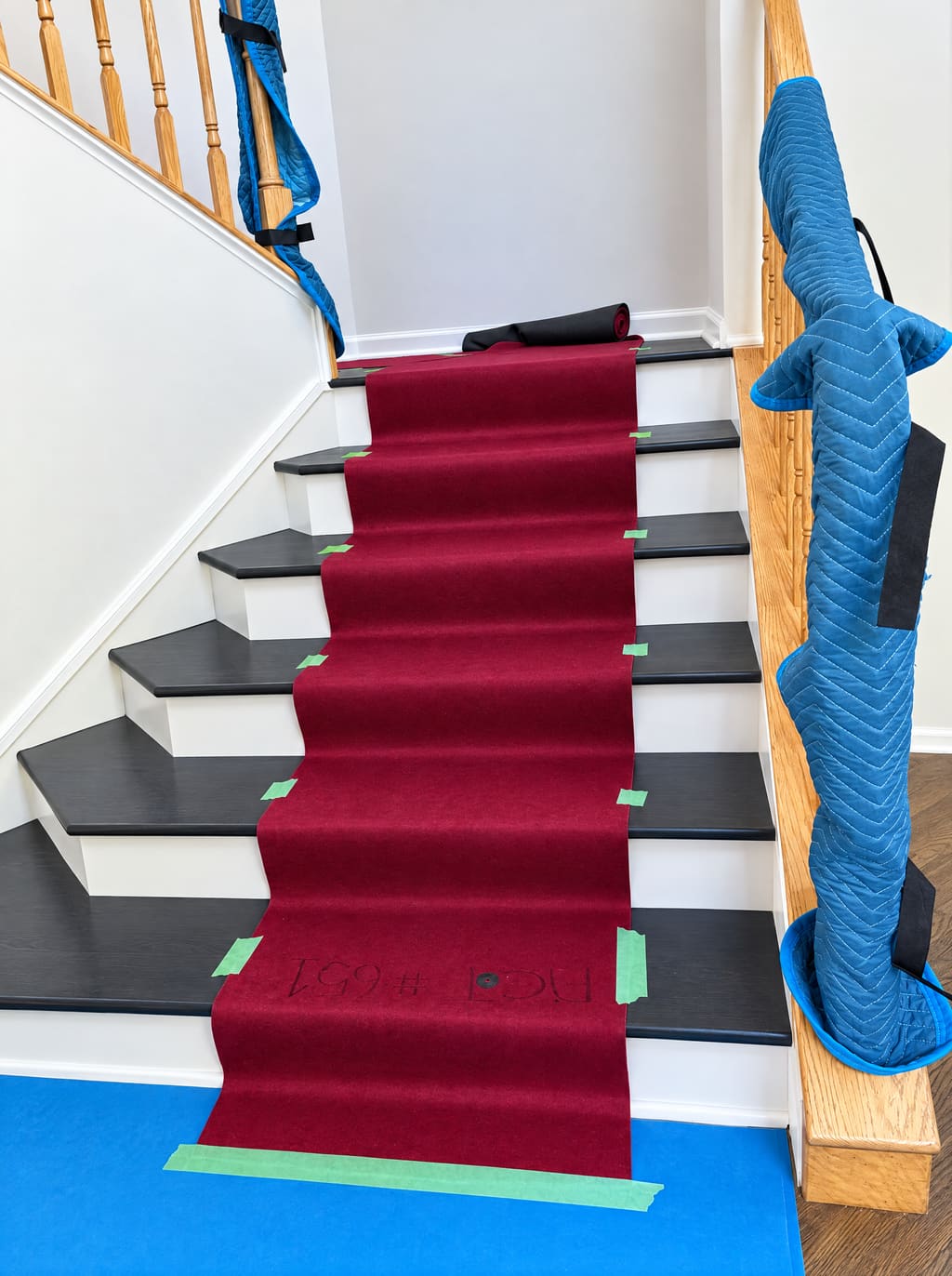 Stairs covered with a red runner