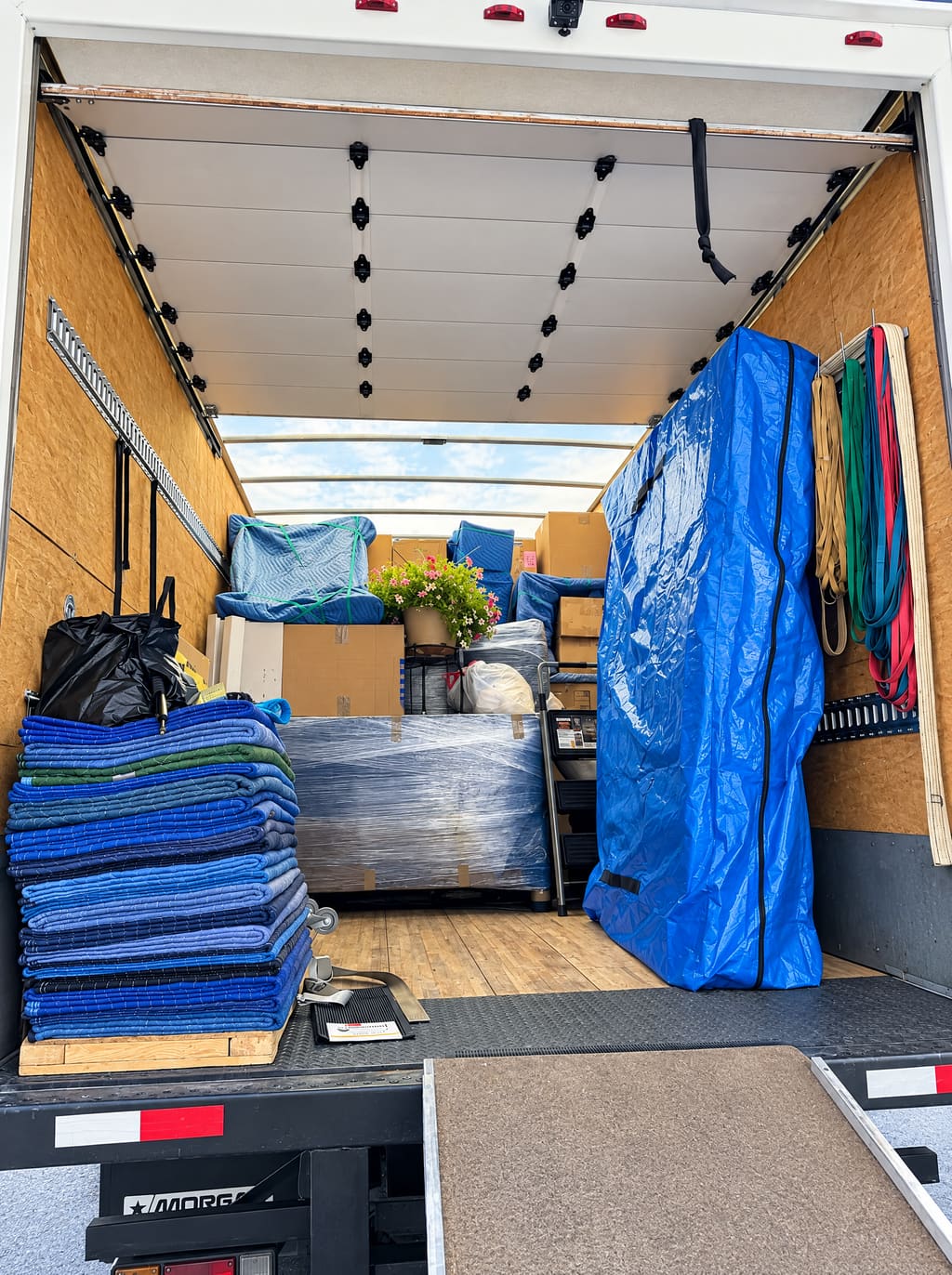 Moving blankets stacked inside the box truck