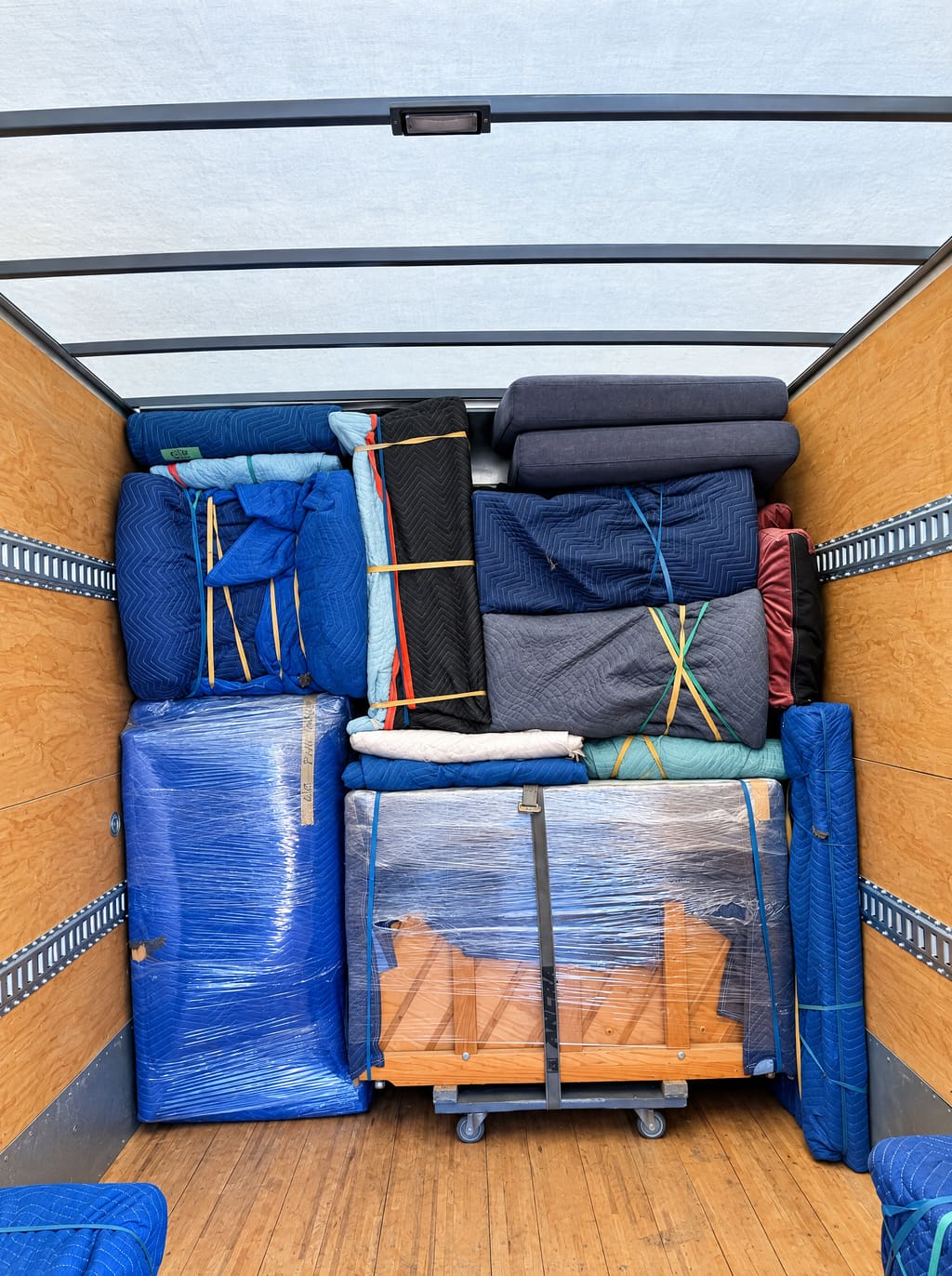 Inside the Brunalli box truck: wrapped furniture and boxes loaded tightly