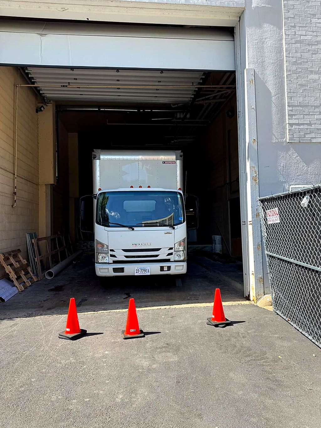 White Brunalli box truck in a loading dock