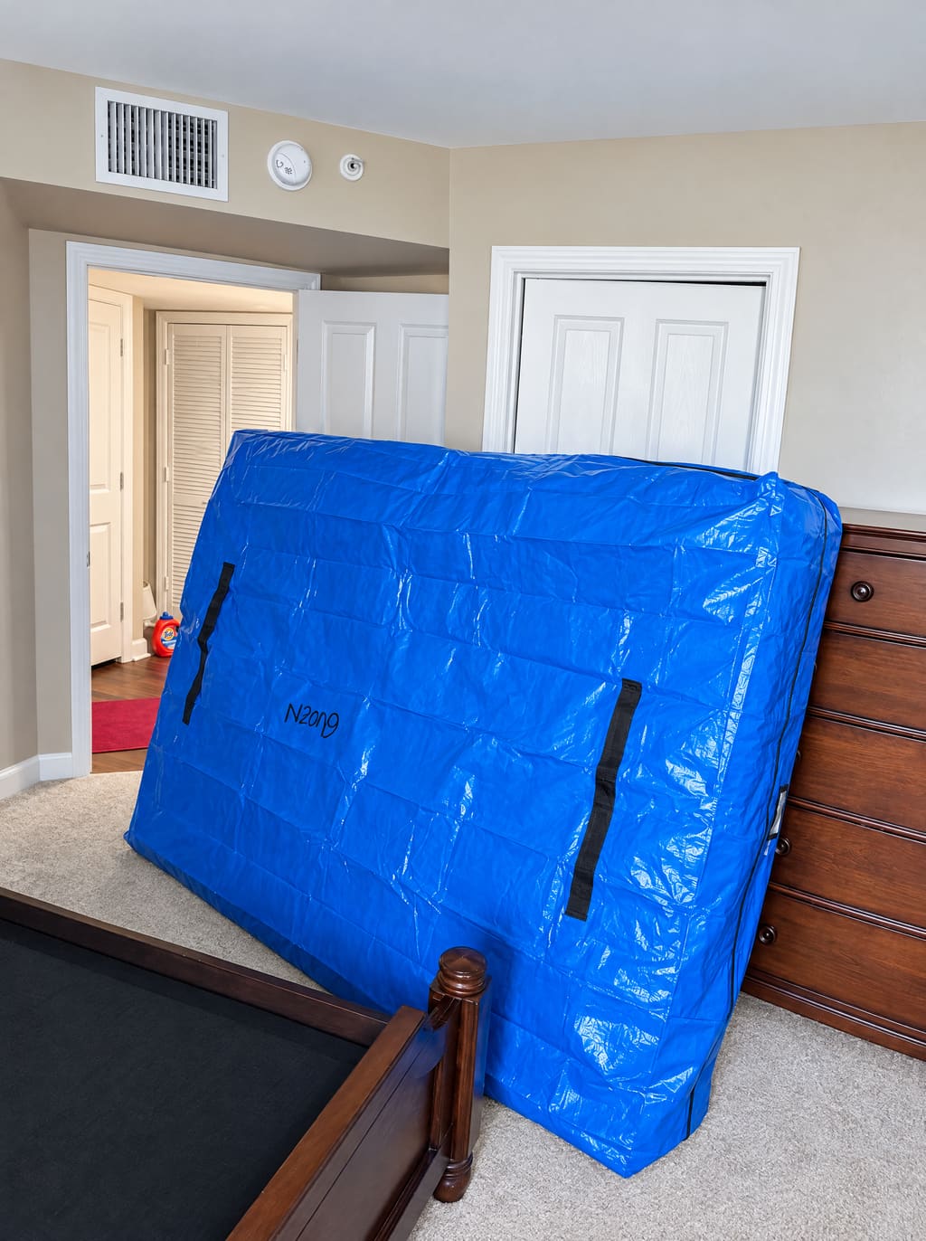 Mattress in a blue mattress bag